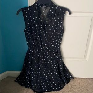 Sleeveless white cross patterned black dress